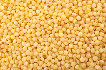 Uncooked ptitim on whole background, close up