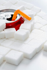 Cola can in pile of sugar cubes