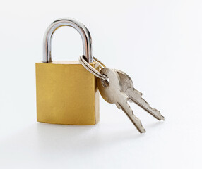 Golden padlock with key on white background
