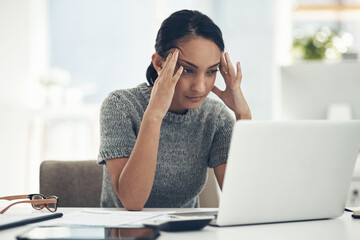 Confused, stressed and anxious businesswoman with laptop suffering from a headache, pressure and...