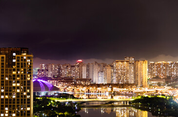 Fototapeta na wymiar Modern city buildings at night