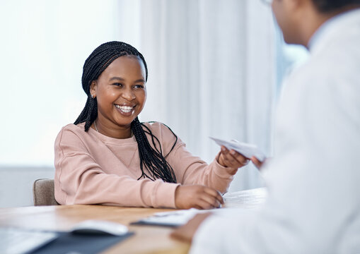 Patient Receiving Medical Script, Prescription And Sick Note From A Doctor During A Consult, Checkup And Visit In A Hospital Or Clinic. Smiling Woman Happy With Good Healthcare Service And Treatment