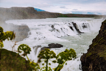 epic waterfall in Iceland mountains