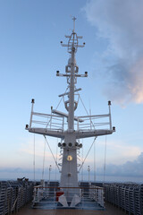 Ship structures, masts, antennas, funnel, ship wheelhouse against the blue sky and clouds. Vessel traveling at ocean. © AJITH.A