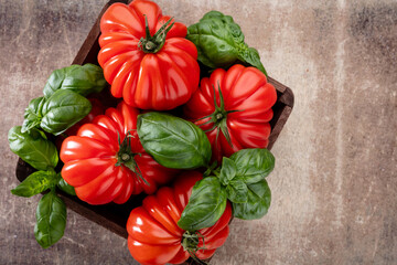 Tomatoes coeur with basil leaf,  close up.