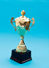 Golden trophy cup with a lid