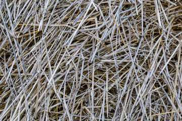 Background of the old darkened wheat straw on a heap