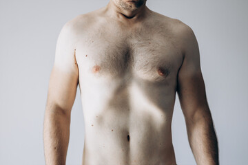 Handsome guy with abs standing without clothes