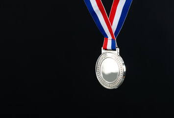 Blank silver medal on black background