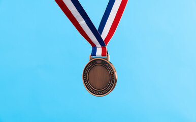 Blank bronze medal on blue background