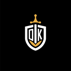Creative letter OK logo gaming esport with shield and sword design ideas © robinstark