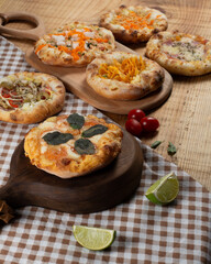 Sfiha on a wooden table with ingredients