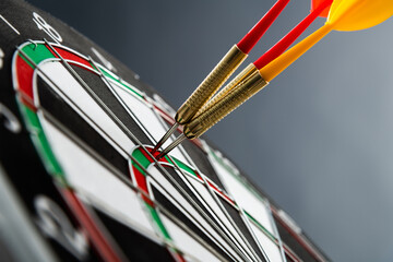 Some darts miss target center