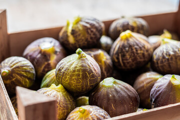Fresh figs in wooden box.