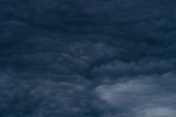 Rain clouds background. The clouds turn dark gray, like big smoke before rain.