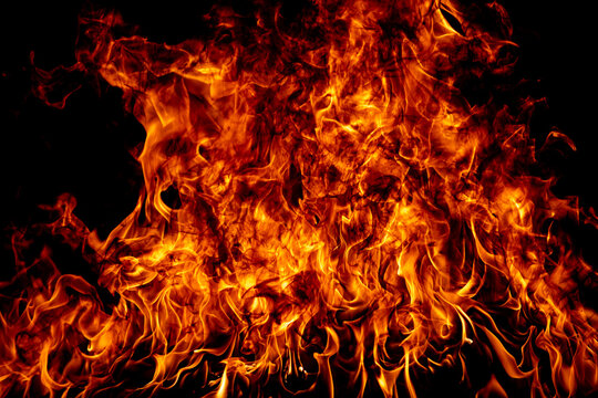 Texture of fire on a black background. Abstract fire flame background, large burning fire.