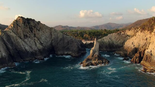 Aerial View Of Dedo de Dios In Playa Maruata In Michoacan, Mexico - drone shot