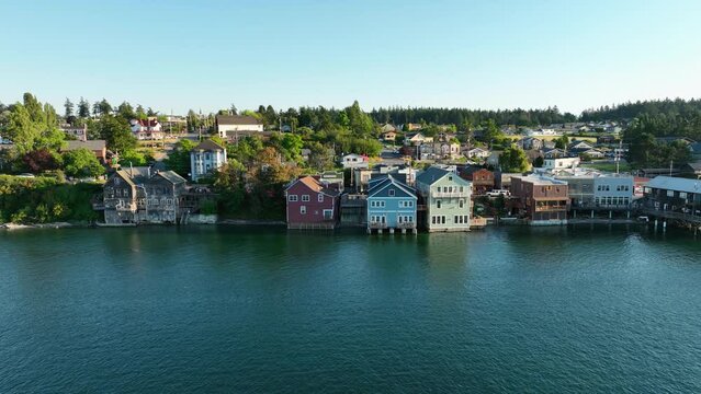 Aerial shot pushing towards Coupeville shops hanging out over the historic waterfront.