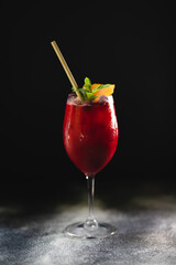 Lemonade with ice on a dark background