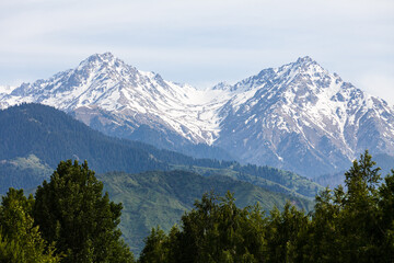Fototapeta premium Magnificent snow-capped mountain peaks in the vicinity of Almaty