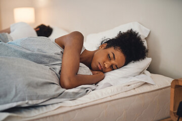 Sad, bad sleep and insomnia of a woman having relationship issues at home. Upset female or couple...