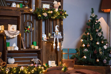 Wall Made of Wooden Boxes With Christmas Decor. Gifts Under New Year Tree. Cozy New Year's Interior