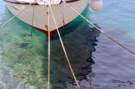 One Boat Tied Up At Sea