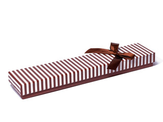Long white and brown striped handmade gift box with a brown bow. Cardboard packaging for small...