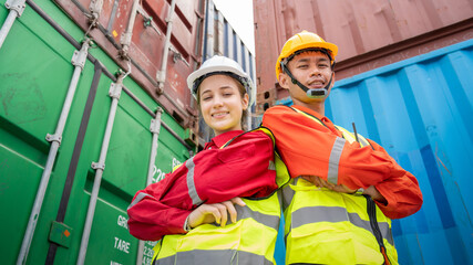 Woman Manager and forman cross arm in front of Cargo forklift in warehouse , Manager use tablet in white helmet Safety Supervisor in Container Custom Terminal port concept import export