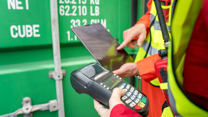 Woman foreman and Operator Using Credit Card Swipe Machine for checking code of Cargo container before import exprot concept logistics transportation shipping, Lady Foreman checking Cargo 