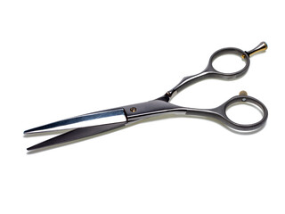 Professional hairdressing scissors, cutting tool. Close-up, isolated on white background