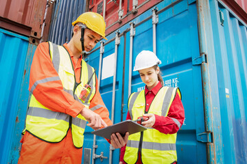 Woman Foreman and Operator Checking Cargo in Container cargo CustomTerminal port, Manager use Tablet for checking cargo concept import export transportation and logistic insurance service