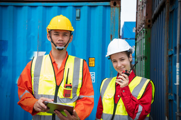 Woman Foreman and Operator Checking Cargo in Container cargo CustomTerminal port, Manager use Tablet for checking cargo concept import export transportation and logistic insurance service