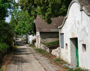 Fototapeta na wymiar Historic Kellergasse , Cellar-lined road in Ottenthal, Lower Austria