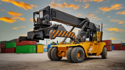 forklift working in the container cargo yard port loading cargo tank logistic service and transportation concept. forwarder mast