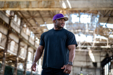 Young sporty man portrait. Handsome athletic male standing.