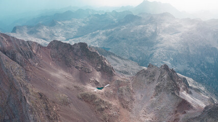 Aerial mountain photography from a drone of peaks such as Los Infernos, Ibon de Pondiellos, a incredible trekking day from the Garmo Negro peak in Panticosa, Pyrenees of Aragon, Spain.