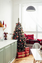 Provencal Kitchen Interior with Christmas Decor. Christmas Tree in Kitchen Near Big Window.