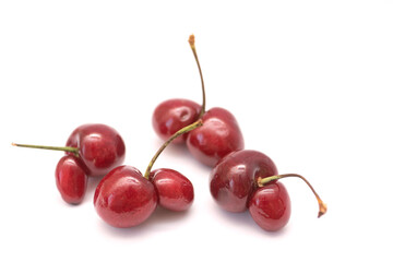 Obraz na płótnie Canvas Ugly Cherry berries on a white background