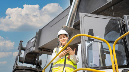 Female Foreman stay on lifting forklift container cargo forklift check or inspect and control forklift concept service and transportation logistic. Foreman using tablet for Daily Check Before Working