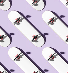 Blank skateboard decks in row template mockup - isolated on purple background - seamless pattern © guteksk7