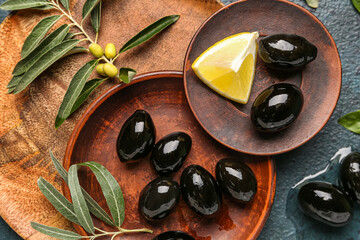 Plates with tasty black olives, closeup
