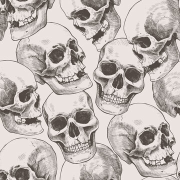 Seamless pattern of hand drawn human skulls. Vector graphic beige illustration.