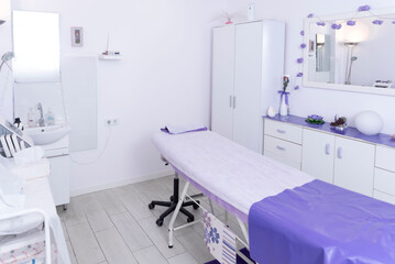 Beauty and body care. The interior of the new beauty salon with a massage table