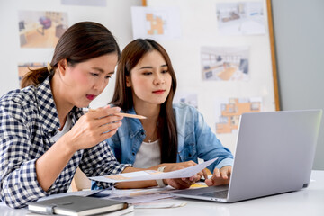 Architect design works drawing sketches, plans, blueprints and building architectural construction models in an architect studio.