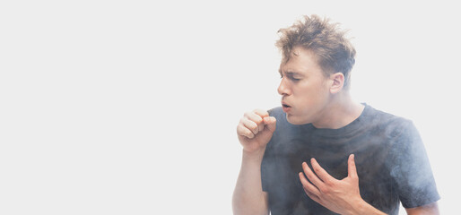 Suffocate in the smoke. Scared young man with stressed emotions isolated over white background with...