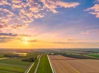 Foto op Plexiglas anti-reflex Sunset over rural Holland - spring - agriculture - countryside - sky - puffy clouds © Alex de Haas