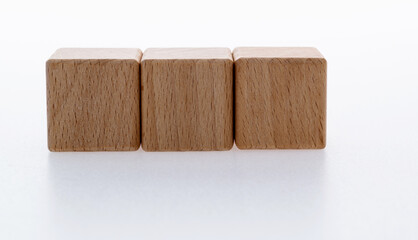 Three wooden blocks on white background