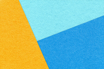 Texture of craft yellow, blue and cerulean shade color paper background. Structure of vintage...