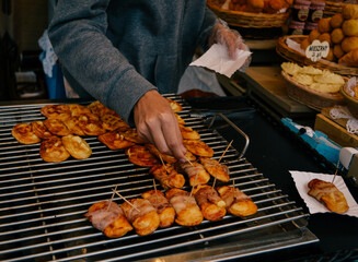 Hand serving at a street food market